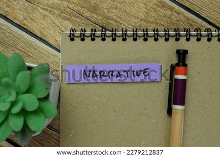 Concept of Narrative write on sticky notes isolated on Wooden Table.