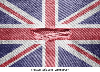 The Concept Of National Flag On Denim Background With A Hole: UK