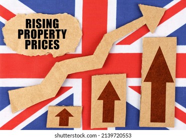 The concept of national statistics. On the flag of Great Britain, a growth chart and a cardboard plate with the inscription - Rising property prices