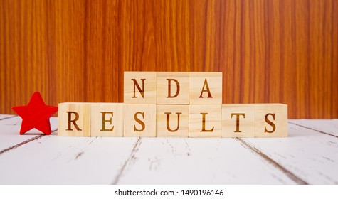 Concept Of NDA Exam Conducted In India For Recruitment, NDA Exam Results On Wooden Block Letters