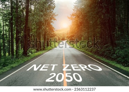 The concept of net zero and carbon neutrality Zero net text on road with beautiful mountain nature forest For the goal of net zero greenhouse gas emissions Long-term climate-neutral strategy