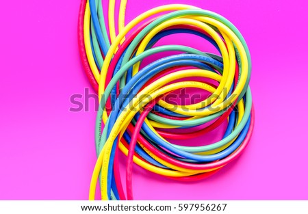concept network internet cable on pink background close up.