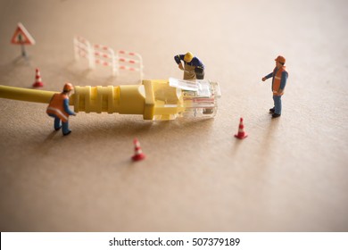 Concept Of Network Troubleshoot Supporter Or Administrator. Internet Connection Support Team Fixing LAN Cable.