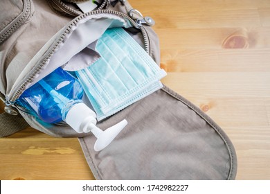 Concept Of New Or Next Normal. Protective Mask, Alcohol Gel In Carry Bag For Protect When Going Outside. New Normal Life After COVID Crisis Impact Around The World Business. Changing Human Lifestyle.