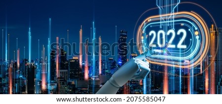 
concept of new year 2022 Vision Technology and Modern city with wireless network connection.Robot finger,Big data and business concept.Robot finger on word 2022 and city network connection background