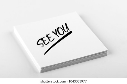 Concept Of Note With The Words See You Written On White Paper. Mockup.