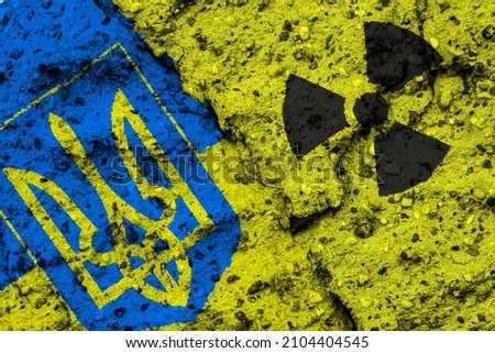 Concept of the Nuclear Energy Policy of Ukraine with a flag and a radiation hazard sign painted on a rough wall