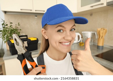 Concept Of Occupation, Young Woman Plumber In Uniform