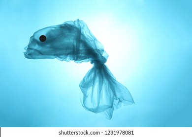 Concept Ocean Fish From A Plastic Bag. Total Pollution Of The Ocean With Garbage.