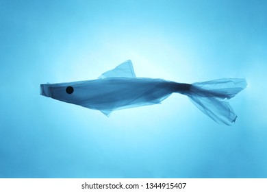 Concept Ocean Fish From A Plastic Bag. Total Pollution Of The Ocean With Garbage.