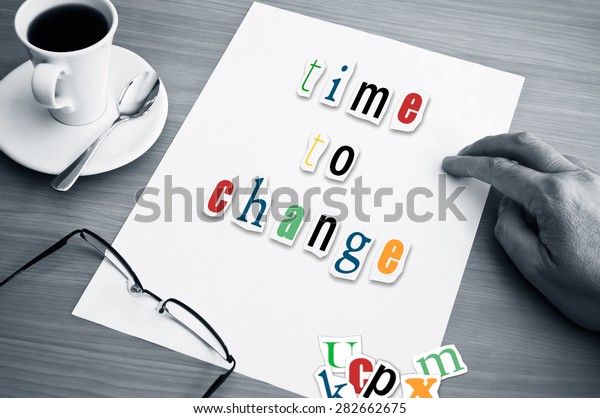 concept office cup of coffee and word time to\
change on white page\
