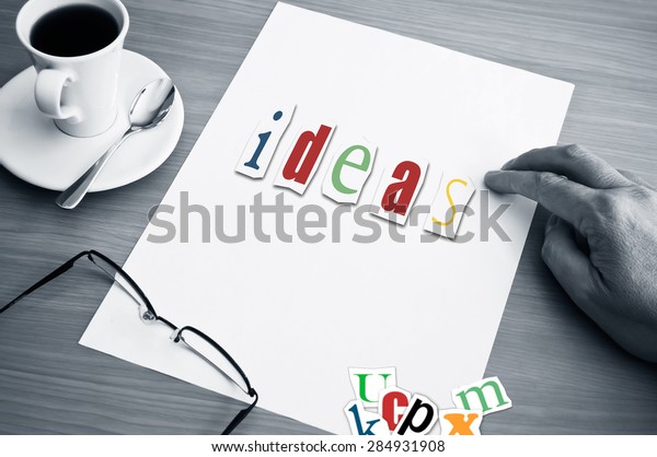 concept\
office cup of coffee and word ideas on white\
page