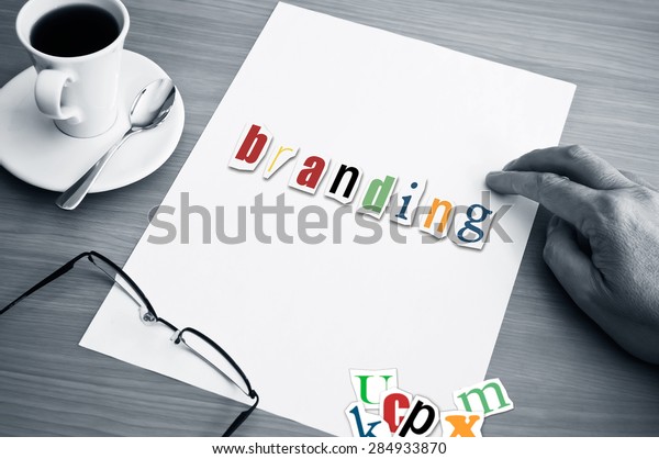 concept office cup of coffee and word branding on white\
page  