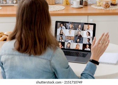 The concept of online video communication. Overlooking on the laptop screen with different people, employees, business partners, guy welcomes colleagues, online briefing, brainstorming, group remote.
