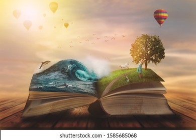 
Concept of an open magic book; open pages with water and land and small child. Fantasy, nature or learning concept, with copy space