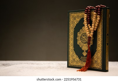  Concept: open Quran book  local language holy prayers for god,Coran - holy book of Muslims religion,
Friday month of 1444 Puasa Ramadan religion Islamic worshiping faith and learn Koran and rosary  - Shutterstock ID 2251956731