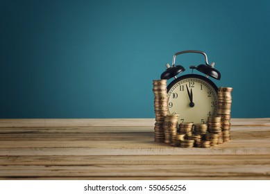 Concept Of Opportunity Cost Time Is Money Clock And Coins On Wooden Table