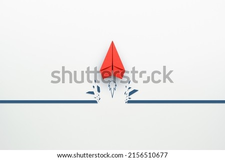 Concept of overcoming barriers, goal, target with red paper plane breaking through obstacle on white background Stockfoto © 