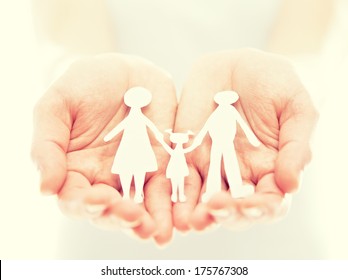 Concept. Paper Figures Of Family In The Hands 