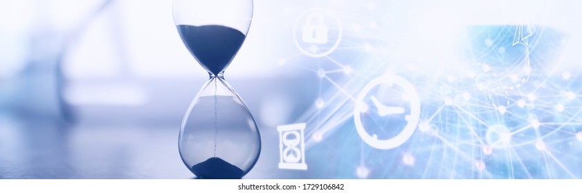 The concept of the passage of time. Hourglass on a dark background. Inscription time. The shadow on surface of the word.