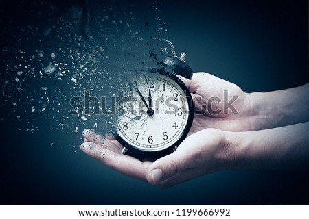 Concept of passing away, the clock breaks down into pieces. Hand holding analog clock with dispersion effect ストックフォト © 