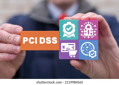 Concept of PCI DSS - Payment Card Industry Data Security Standard. Businessman holding colorful polystyrene blocks with PCIDSS payment security standard conceptual presentation.