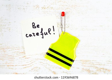 Concept Of Pedestrian Safety. Reflector Keychain And Label With 