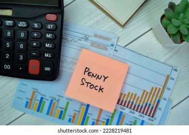 Concept of Penny Stock write on sticky notes isolated on Wooden Table. - Shutterstock ID 2228219481