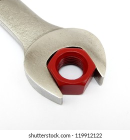 Concept Of Perfect Fit.  Using A Red Hexagon Nut And Wrench To Convey Abstract Theme.