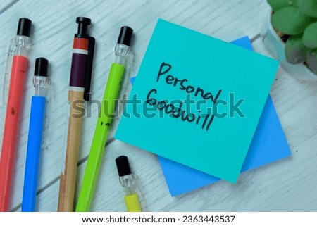 Concept of Personal Goodwill write on sticky notes isolated on Wooden Table.