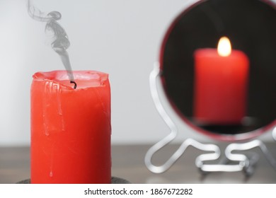 Concept photo extinct candle that is not reflected in the mirror Christmas divination   spirituality Religion   divine Psychology motivation Power thought Never give up go for your goals 