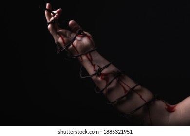 Concept Photo Of A Hand And Arm Tied With Barbed Wire In Studio Artistic Conversion