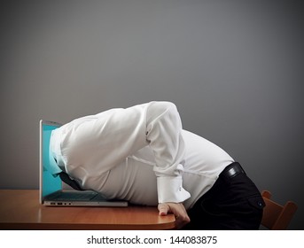 concept photo of internet addiction. man plunging into computer