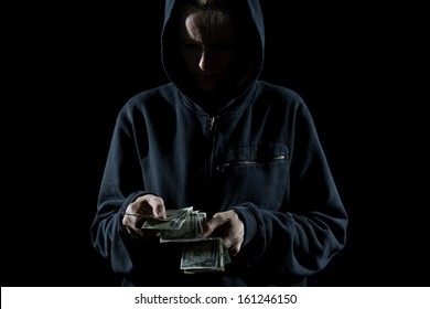 Concept Photo Showing A Thief Counting The Money