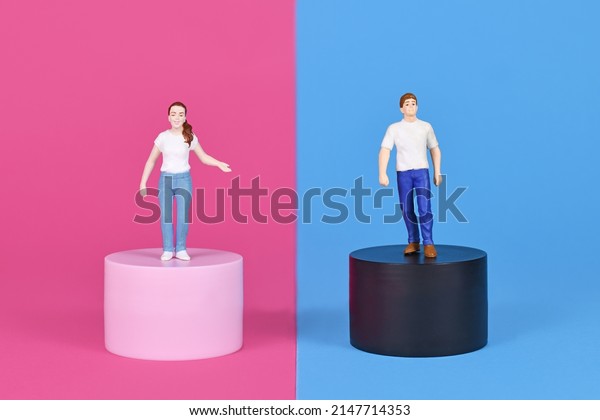 Concept for pink and blue\
gender stereotypes with man and woman figure on different colored\
backgrounds
