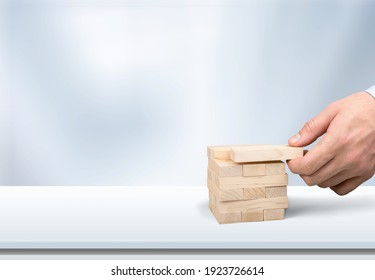 Concept plugin for websites on wooden blocks.Hand with cubes