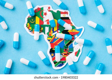 Concept Of Poor Condition Of Medicine In Developing African Countries. Many Pills And Capsules Over A Map Of Africa Continent With National Flags Of Countries