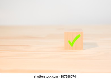 Concept of positive decision making or choice of approval. cross mark x on wooden cube. red cross sign on the edge of a wooden cube. - Shutterstock ID 1875880744