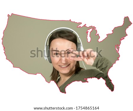 The concept of positive emotions. A young woman smiles and enjoys life. The portrait of the woman is inscribed in the contours of the map of the United States. Isolate.