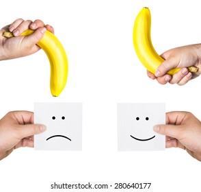 concept of potency, concept of penis,  two men's hands holding smiley and sad  faces,  two hands hold the big bananas up and down, like the man penis, short, small, medium, average, long or large size