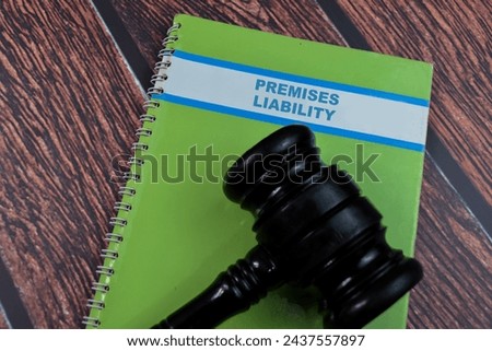 Concept of Premises Liability write on book isolated on Wooden Table.