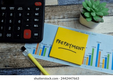 Concept of Prepayment write on sticky notes isolated on Wooden Table. stock market concept