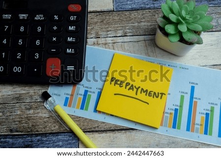 Concept of Prepayment write on sticky notes isolated on Wooden Table. stock market concept