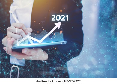 Concept presenting the technology business Graph of revenue generated by laptops, process overview, total enterprise average for the year 2021