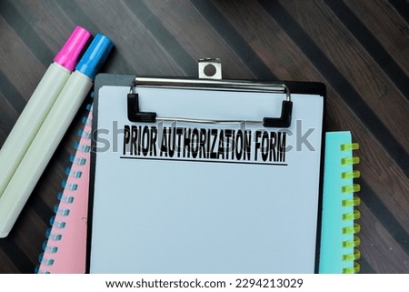 Concept of Prior Authorization Form write on paperwork isolated on Wooden Table.