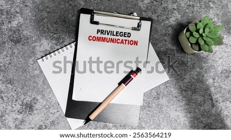 Concept of Privileged Communication write on paperwork isolated on Wooden Table.