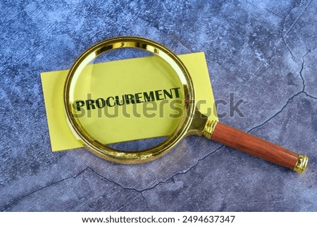 Concept of procurement. PROCUREMENT appeared through a magnifying glass on yellow paper on an abstract background