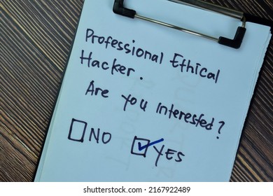 Concept of Professional Ethical Hacker. Are you interested? Yes write on a paperwork isolated on Wooden Table.
