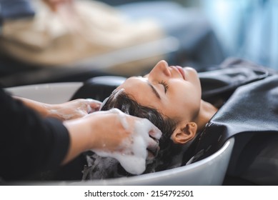 concept of professional fashion hairdresser and hair beauty salon, hairstylist making treatment to woman client person, by using scissors for haircut and coiffure care, girl style in studio lifestyle