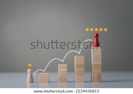 Concept of progress and growth, talent development Highest level promotion to organizational leadership, Businessman stepping over the wooden cubes to the goal successfully, HR, HRM, HRD Concept.